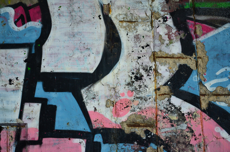 Texture of a fragment of the wall with graffiti painting, which is depicted on it. An image of a piece of graffiti drawing as a photo on street art and graffiti culture topicsの写真素材