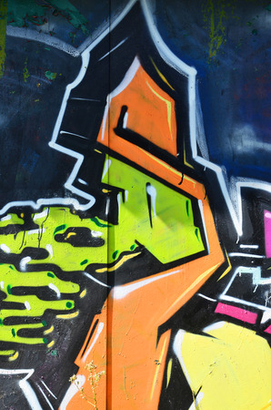The old wall, painted in color graffiti drawing green aerosol paints. Background image on the theme of drawing graffiti and street artの写真素材