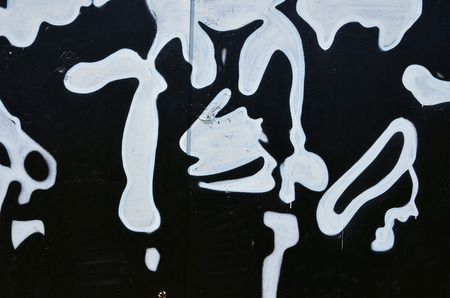 The old wall, painted in color graffiti drawing with aerosol paints. Background image on the theme of drawing graffiti and street artの写真素材