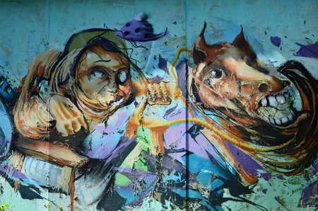 The old wall, painted in color graffiti drawing with aerosol paints. The image of terrible faces. Background image for Halloweenの写真素材