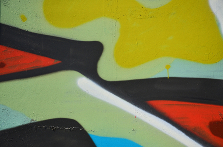 The old wall, painted in color graffiti drawing green aerosol paints. Background image on the theme of drawing graffiti and street artの写真素材