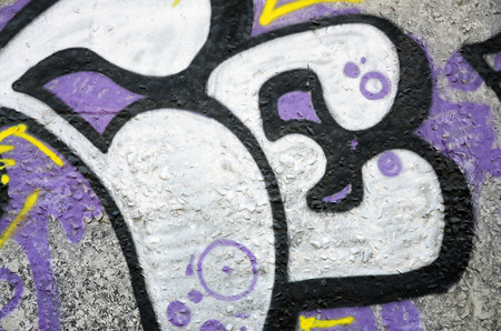 Texture of a fragment of the wall with graffiti painting, which is depicted on it. An image of a...