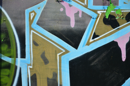 The old wall, painted in color graffiti drawing with aerosol paints. Background image on the theme of drawing graffiti and street artの写真素材