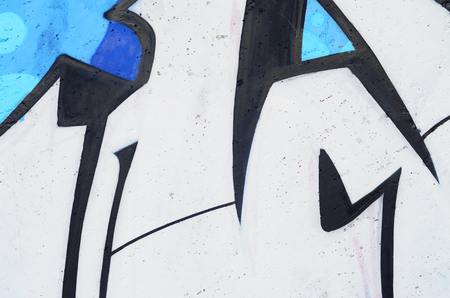 Background image of a concrete wall with a piece of abstract graffiti pattern. Street art, vandalism and youth hobbiesの写真素材