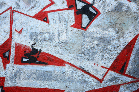 Texture of a fragment of the wall with graffiti painting, which is depicted on it. An image of a piece of graffiti drawing as a photo on street art and graffiti culture topicsの写真素材