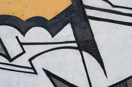 Background image of a concrete wall with a piece of abstract graffiti pattern. Street art, vandalism and youth hobbiesの写真素材