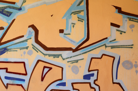 Concrete weathered worn wall damaged paint. Grungy Concrete Surface with graffiti colors and outlines. Street art background texture. Close up painted wall of the cityの写真素材