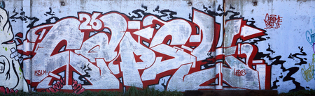 The texture of the wall with graffiti, which is depicted on it. The image of the whole and complete graffiti of the drawing as a resource for the design of 3D projectsの写真素材