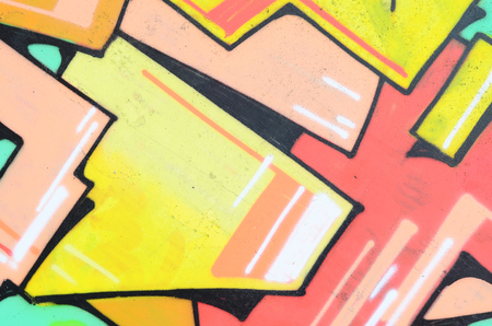 Background image with a colored graffiti pattern, which is applied to the concrete wall with aerosol paints. A lot of contours and fragments filled with paint, forming an interesting compositionの写真素材