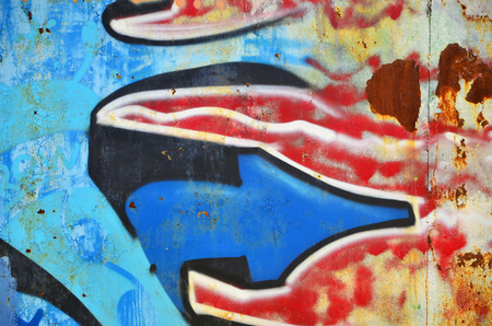 The old wall, painted in color graffiti drawing blue aerosol paints. Background image on the theme of drawing graffiti and street artの写真素材