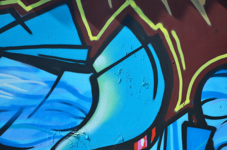 The old wall, painted in color graffiti drawing blue aerosol paints. Background image on the theme of drawing graffiti and street artの写真素材