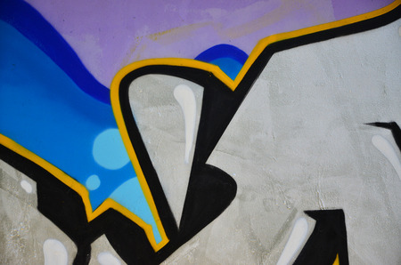 The old wall, painted in color graffiti drawing silver chrome aerosol paints. Background image on the theme of drawing graffiti and street artの写真素材