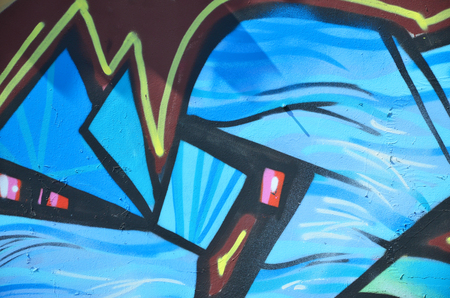 The old wall, painted in color graffiti drawing blue aerosol paints. Background image on the theme of drawing graffiti and street artの写真素材