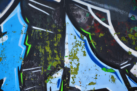 The old wall, painted in color graffiti drawing with aerosol paints. Background image on the theme of drawing graffiti and street artの写真素材