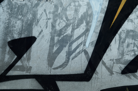 Background image with a graffiti pattern, which is applied to a concrete wall with aerosol paintsの写真素材