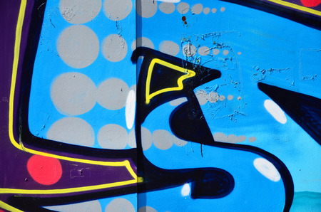 The old wall, painted in color graffiti drawing blue aerosol paints. Background image on the theme of drawing graffiti and street artの写真素材