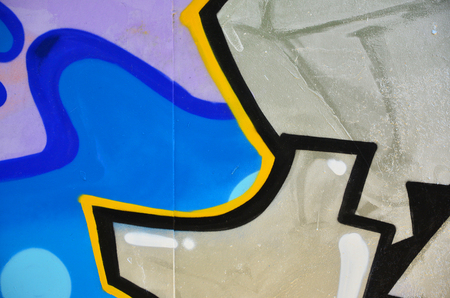 The old wall, painted in color graffiti drawing blue aerosol paints. Background image on the theme of drawing graffiti and street artの写真素材