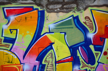 Some elements of a large and composite graffiti pattern on the wall, made with different colors of aerosol paintsの写真素材