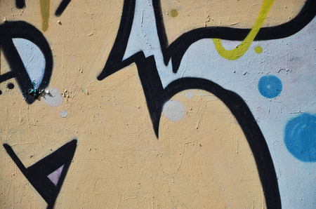 The old wall, painted in color graffiti drawing with aerosol paints. Background image on the theme of drawing graffiti and street artの写真素材