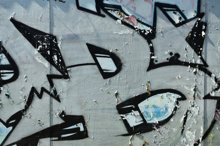 The old wall, painted in color graffiti drawing silver chrome aerosol paints. Background image on the theme of drawing graffiti and street artの写真素材