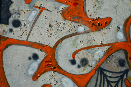 The old wall, painted in color graffiti drawing silver chrome aerosol paints. Background image on the theme of drawing graffiti and street artの写真素材