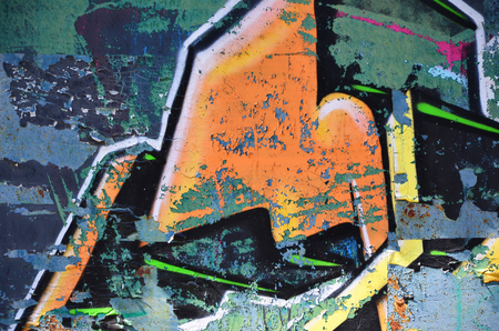 The old wall, painted in color graffiti drawing with aerosol paints. Background image on the theme of drawing graffiti and street artの写真素材