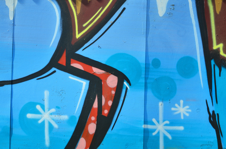 The old wall, painted in color graffiti drawing blue aerosol paints. Background image on the theme of drawing graffiti and street artの写真素材