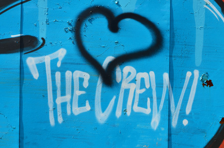 The old wall, painted in color graffiti drawing blue aerosol paints. Background image on the theme of drawing graffiti and street artの写真素材