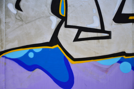 The old wall, painted in color graffiti drawing silver chrome aerosol paints. Background image on the theme of drawing graffiti and street artの写真素材