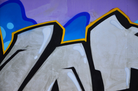 The old wall, painted in color graffiti drawing blue aerosol paints. Background image on the theme of drawing graffiti and street artの写真素材