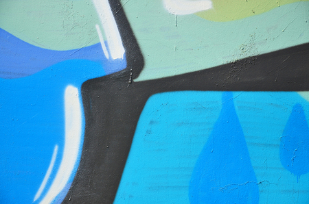 The old wall, painted in color graffiti drawing blue aerosol paints. Background image on the theme of drawing graffiti and street artの写真素材