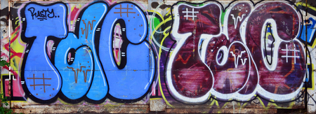 Beautiful street art graffiti. Abstract color creative drawing fashion colors on the walls of the city. Urban Contemporary Culture. Title paint on walls. Culture youth protestの写真素材