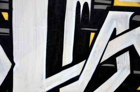 Background image of the wall decorated with colorful abstract graffiti. Street art conceptの写真素材