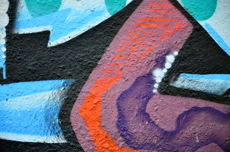 Street art. Colorful graffiti on the wall. Fragment for background. Abstract detail of a graffitiの写真素材
