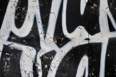Background image of the wall decorated with colorful abstract graffiti. Street art conceptの写真素材