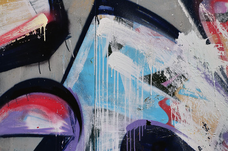 Street art. Colorful graffiti on the wall. Fragment for background. Abstract detail of a graffitiの写真素材