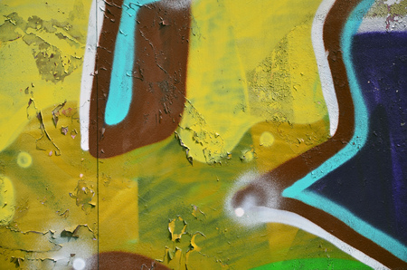 Background image of the wall decorated with colorful abstract graffiti. Street art conceptの写真素材