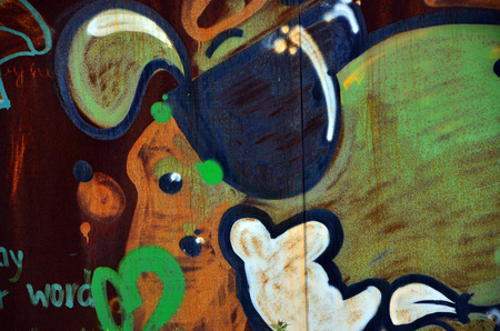 Art under ground. Beautiful street art graffiti style. The wall is decorated with abstract drawings house paint. Modern iconic urban culture of street youth. Abstract stylish picture on wallの写真素材