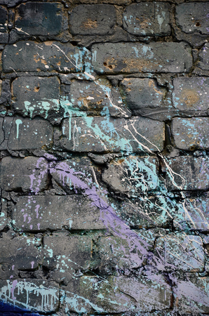 Background image of the wall decorated with colorful abstract graffiti. Street art conceptの写真素材