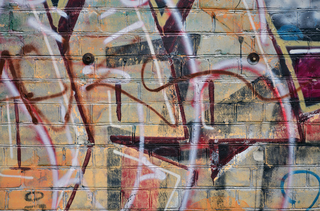 Street art. Colorful graffiti on the wall. Fragment for background. Abstract detail of a graffitiの写真素材