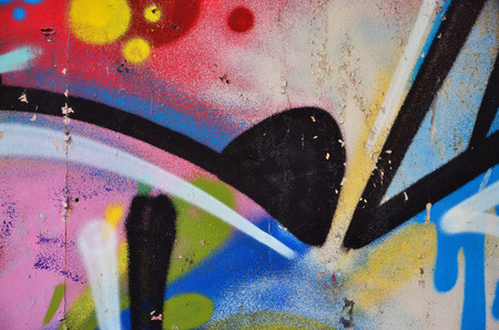 Background image of the wall decorated with colorful abstract graffiti. Street art conceptの写真素材
