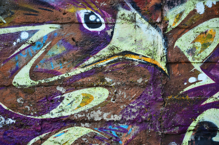 Close up view of graffiti drawing details. Background image on the theme of street art and vandalism. Texture of the wall, painted with aerosol paintsの写真素材