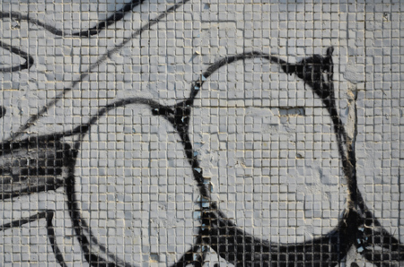 Close up view of graffiti drawing details. Background image on the theme of street art and vandalism. Texture of the wall, painted with aerosol paintsの写真素材