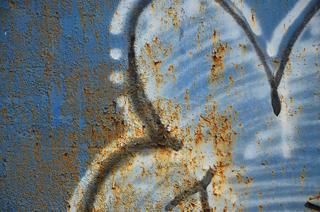 Close up view of graffiti drawing details. Background image on the theme of street art and vandalism. Texture of the wall, painted with aerosol paintsの写真素材