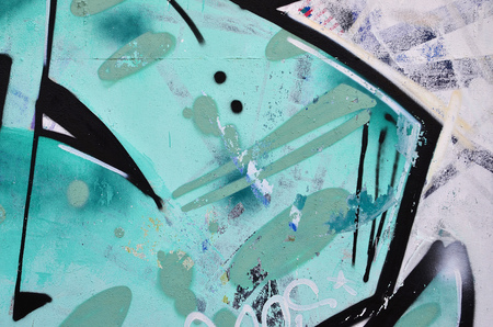 Close up view of graffiti drawing details. Background image on the theme of street art and vandalism. Texture of the wall, painted with aerosol paintsの写真素材