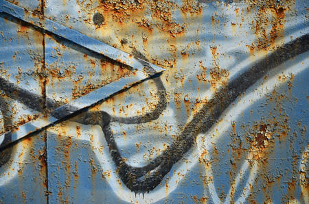 Close up view of graffiti drawing details. Background image on the theme of street art and vandalism. Texture of the wall, painted with aerosol paintsの写真素材