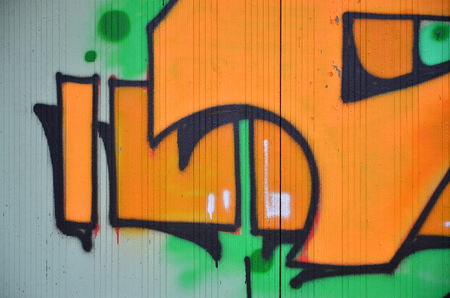 Close up view of graffiti drawing details. Background image on the theme of street art and vandalism. Texture of the wall, painted with aerosol paintsの写真素材