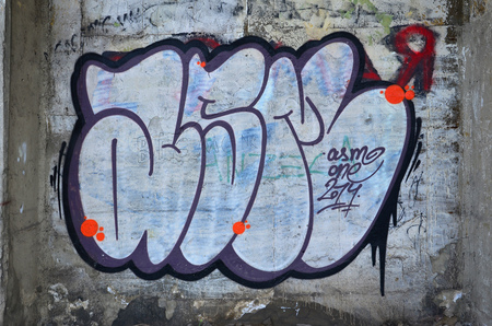 Close up view of graffiti drawing details. Background image on the theme of street art and vandalism. Texture of the wall, painted with aerosol paintsの写真素材