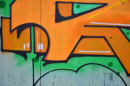 Close up view of graffiti drawing details. Background image on the theme of street art and vandalism. Texture of the wall, painted with aerosol paintsの写真素材