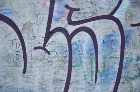 Close up view of graffiti drawing details. Background image on the theme of street art and vandalism. Texture of the wall, painted with aerosol paintsの写真素材